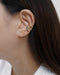 channel androgynous cool with the hexad's geology mismatched ear cuffs set in gold and silver