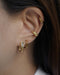 curate your next ideal ear stack with the hexad's stellar ear cuff and retractable hoop in gold