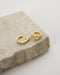 deliberately mismatched pair of esme ear cuffs designed to be worn together for an impactful stack or as separate pieces for a versatile unique look