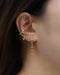 fake a bold and modern double conch piercing with mischief ear cuffs from thehexad