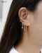 gold ear party with cascading chains and no-piercing ear cuff by the hexad jewelry