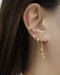 layer on the hexad diamond huggie hoops with our best selling ear cuffs for a stunning stacked look