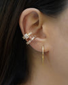 mismatched esme ear cuffs with baguette diamonds in gold by the hexad