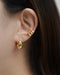 simply yet stylish ear stack featuring trapezoid ear cuffs and solaris teardrop hoop in gold